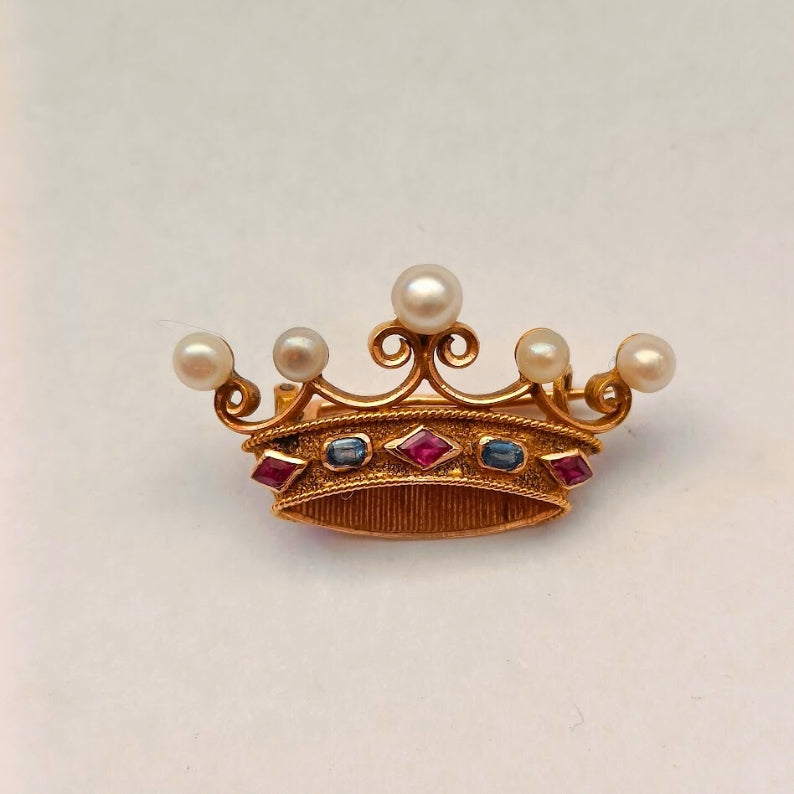 Gold crown-shaped brooch with pearls and gemstones 